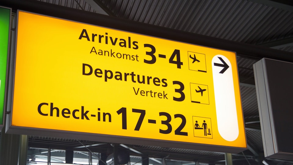 Airport sign: Arrivals, Departures, Check-in