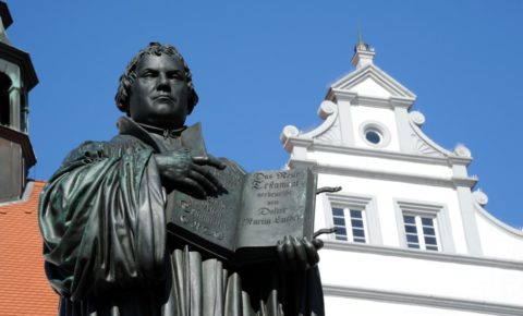 stature of Johannes Gutenberg with his Bible